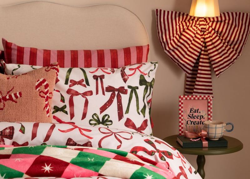 A Christmas bow duvet cover set with Christmas cushions