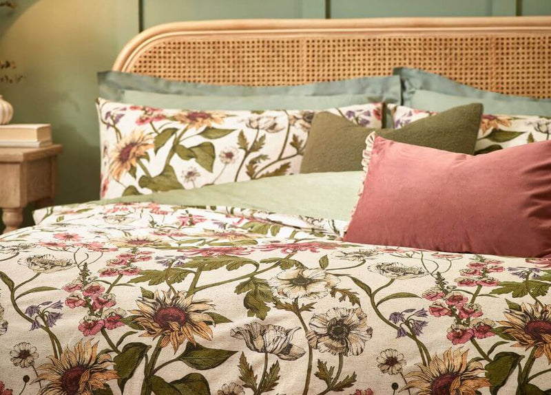 A green duvet cover set with an embroidered floral design on soft velvet fabric.