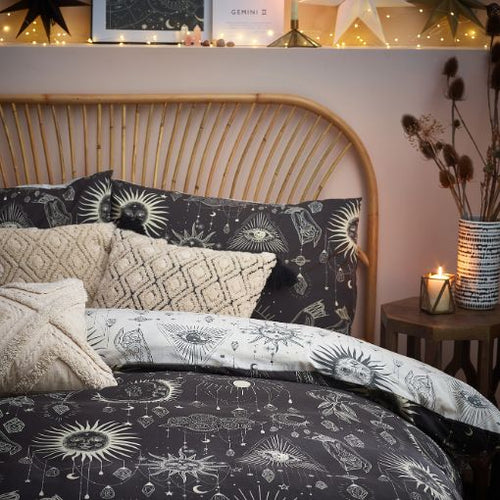 Halloween duvet cover set in black and white, featuring a vibrant galaxy of moon and stars surrounding mystical jewels
