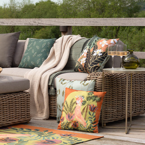 transport your living room outdoors with layers of outdoor cushions