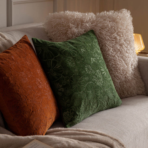 Halloween cushions featuring pumpkins and fluffy textures