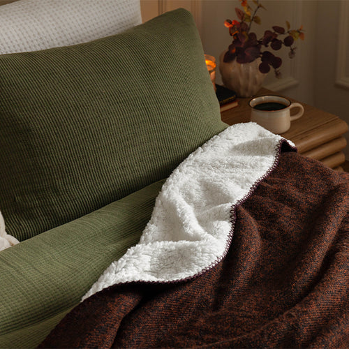 cosy waffle bedding layered with faux fur throw