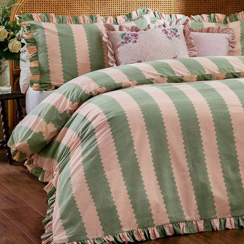 A striped bedding set in pink and green, featuring a wide stripe and a ruffled edge with matching pillow cases