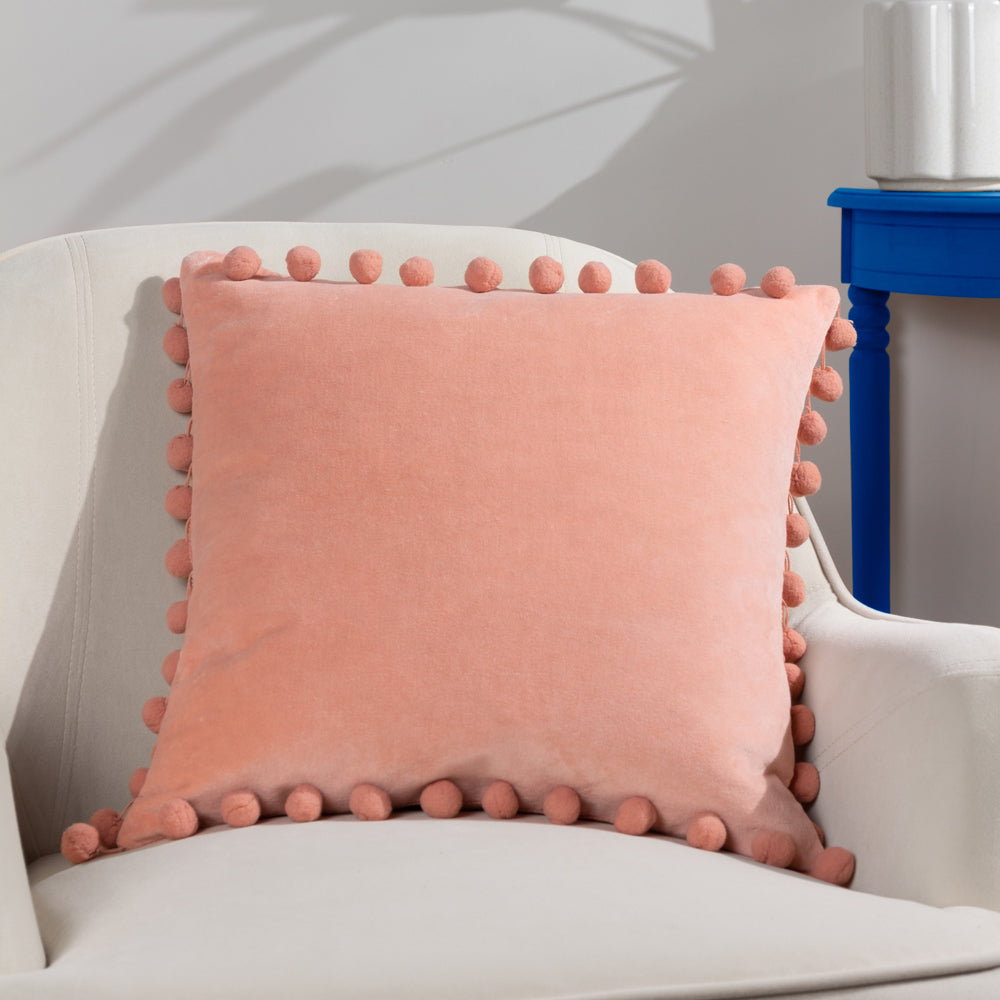 Blush pink outlet pom pom cushion