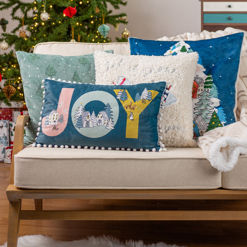 sofa pilled up with christmas cushions