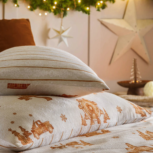 warm neutral Christmas themed bedroom with matching duvet and cushions